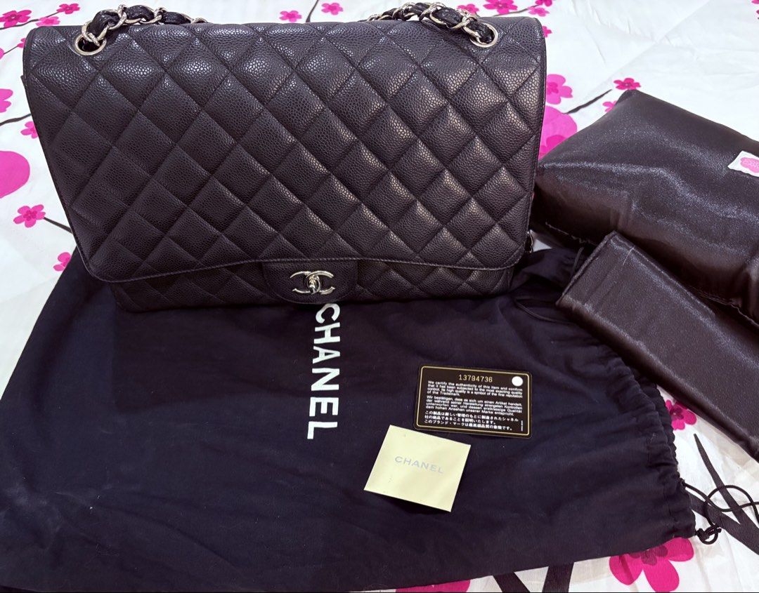 Chanel Maxi Flap Bag Black Caviar Leather (Category: Luxury Bags & Wallets) located in Manila. Submitted by adp2021 (Listing ID 1453695861, Image 1). Description: - Classic Maxi Chanel flap bag in black caviar leather. - Excellent Condition - Complete, Authenticity card, holo, booklet, dust bag - Guaranteed Authentic SERIOUS BUYERS ONLY!.