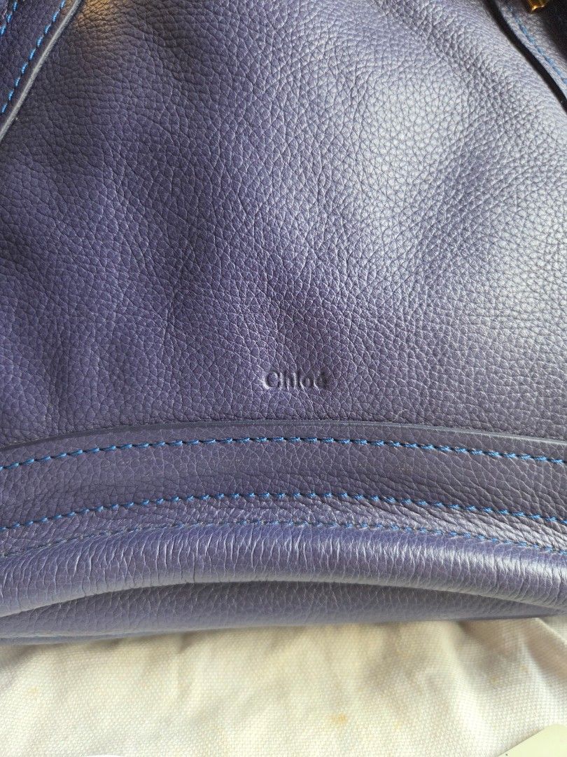 Chloe Paraty Storm Blue (Category: Luxury Bags & Wallets) located in Quezon City. Submitted by shop.mar.go (Listing ID 1453663727, Image 2). Description: used twice then kept very clean leather, no rubs or signs of usage on the egdes of the bag. interior has slight discoloration due to hardware-lining when kept but barely noticeable. no foul smell. inclusion posted in the 1st photo..