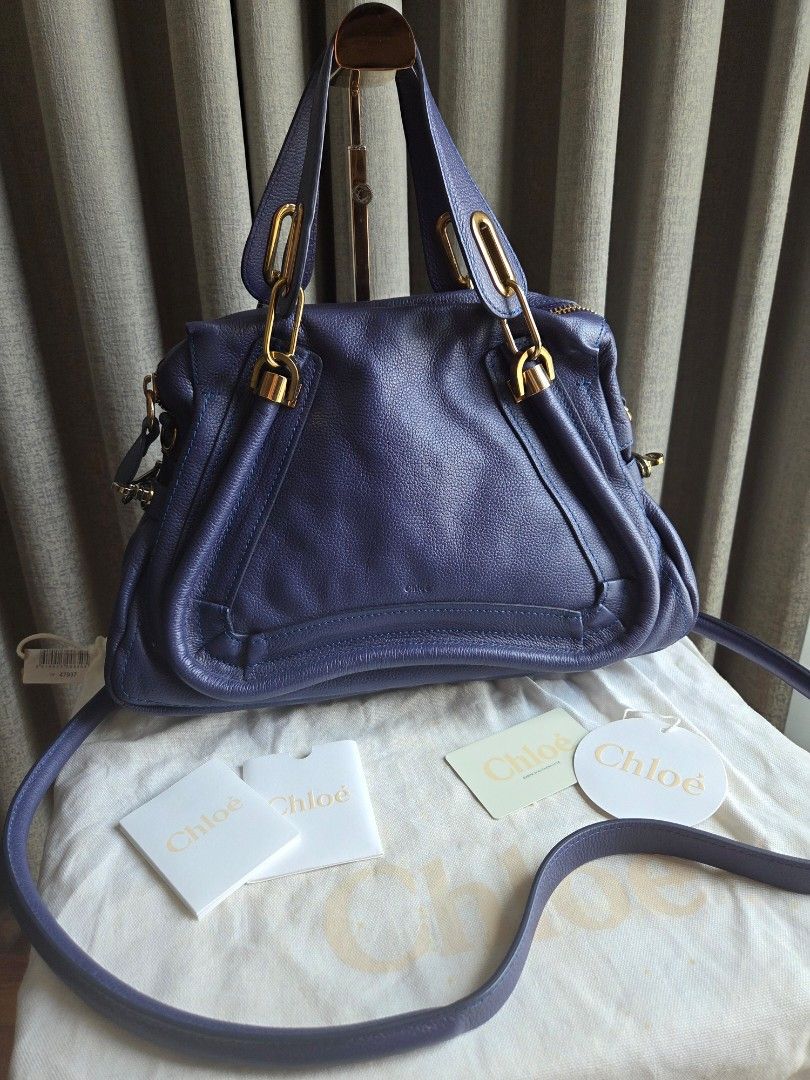Chloe Paraty Storm Blue (Category: Luxury Bags & Wallets) located in Quezon City. Submitted by shop.mar.go (Listing ID 1453663727, Image 1). Description: used twice then kept very clean leather, no rubs or signs of usage on the egdes of the bag. interior has slight discoloration due to hardware-lining when kept but barely noticeable. no foul smell. inclusion posted in the 1st photo..