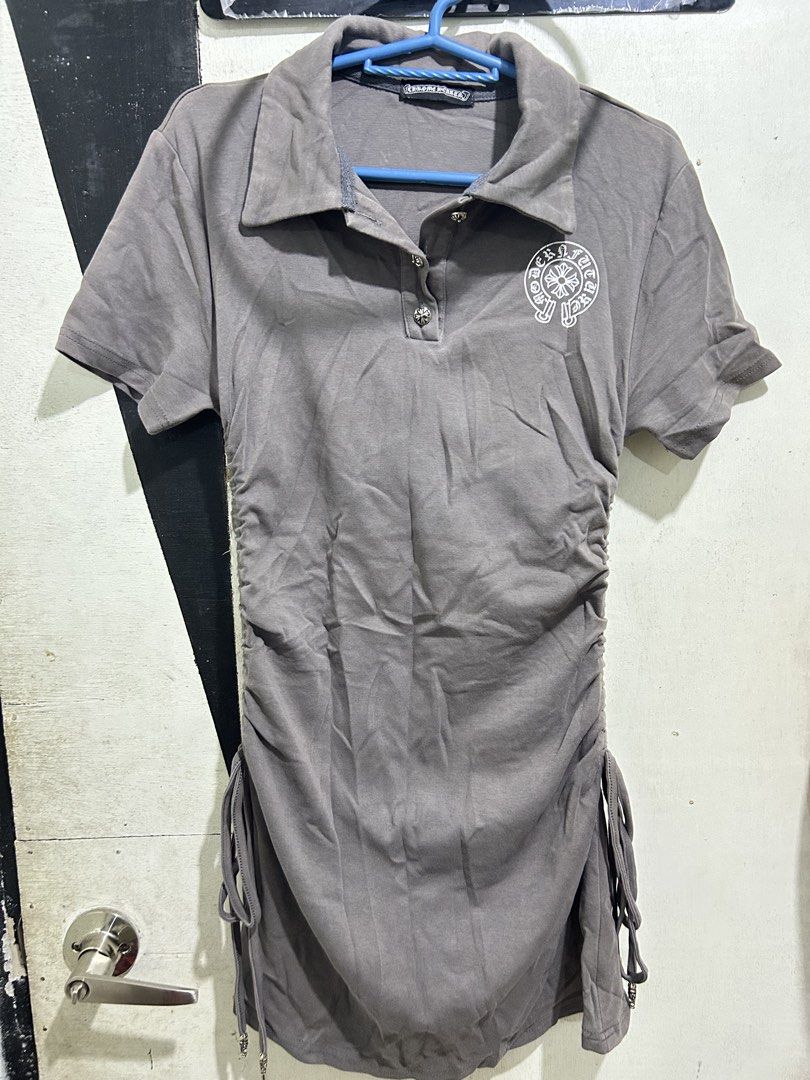 Chrome Hearts Grey Ruched Polo Dress (Category: Dresses) located in Quezon City. Submitted by _breentineee (Listing ID 1453769415, Image 1). Description: - Grey polo dress - Ruched sides with drawstring detail - Chrome Hearts logo on chest - Button-up collar - Estimated size: M to L - Ideal for a stylish casual outfit - Faded color at the upper part - Loc. Commonwealth Manggahan .