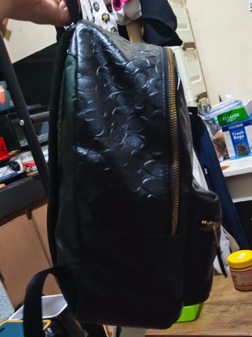 Coach Charlie Black Embossed Signature Backpack (Category: Luxury Bags & Wallets) located in Munoz. Submitted by harm0nica337 (Listing ID 1453756703, Image 3). Description: Thrifted made in Philippines - All-over embossed signature pattern - Gold-tone zippers and hardware - Convenient front zip pocket - Adjustable shoulder straps for comfort Flaws: Zips on one direction (to left side) only , signs of wear as shown in the pics, repainted with blac