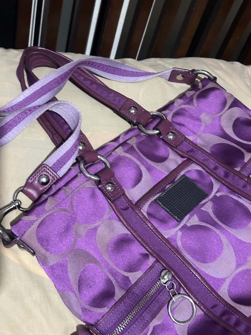 Coach Signature C Monogram Purple Handbag (Category: Luxury Bags & Wallets) located in Quezon City. Submitted by bshoppe_ (Listing ID 1453515169, Image 2). Description: - Authentic purple Coach handbag with signature 'C' monogram pattern. - Two convenient zippered pockets on the front. - Dual top handles for easy carrying. - Includes a detachable shoulder strap for versatile wear. - Lined interior with practical compartments for organization. - I