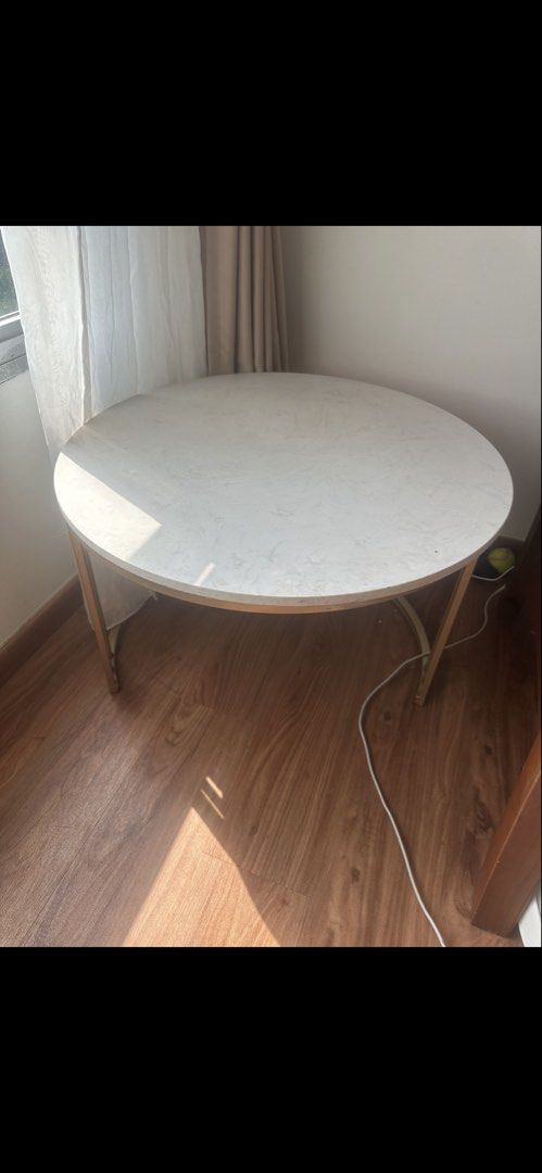 Coffee table (Category: Tables & Sets) located in Singapore. Submitted by goxela72 (Listing ID 1453671340, Image 1). Description: - Round coffee table with a marble-effect tabletop. Diameter 70cm - Features elegant gold-toned legs. - Modern and stylish design. - Suitable for living rooms or as a side table..