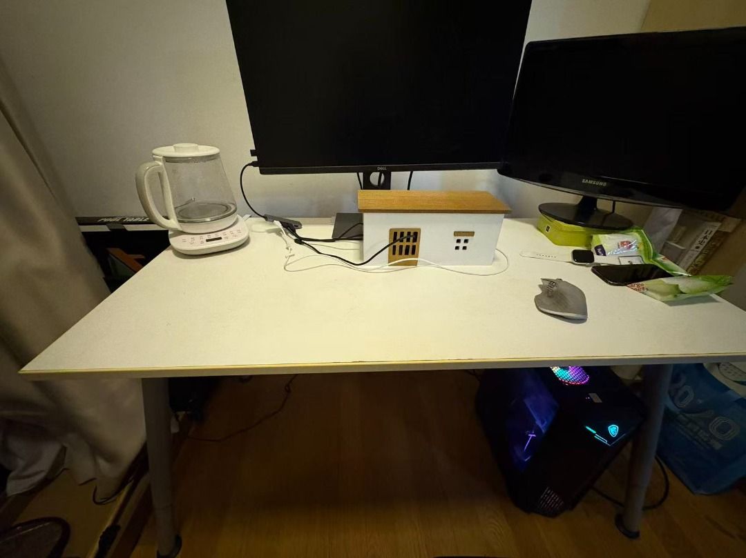 Computer & Study table (Category: Tables & Sets) located in Singapore. Submitted by JamieHudson (Listing ID 1453766991, Image 1). Description: Dimension: height is ~70cm, length is ~120cm, width is ~60cm 1. Spacious white tabletop — comfortably fits dual monitors, mechanical keyboard, mouse, and a full desktop tower underneath 2. Slim metal tube legs — lightweight yet stable, with adjustable feet for uneven flooring 3. Versatile size — works well
