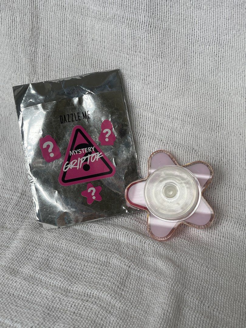 Dazzle Me Mystery Griptok Star Shaped Pink (Category: Other Mobile & Gadget Accessories) located in Manila. Submitted by prima_onda (Listing ID 1453662913, Image 3). Description: - Dazzle Me Mystery Griptok - Unique star shape - Pink design with 'Boundless Beautiful' text - Includes original mystery packaging - Ideal phone accessory - Unused.