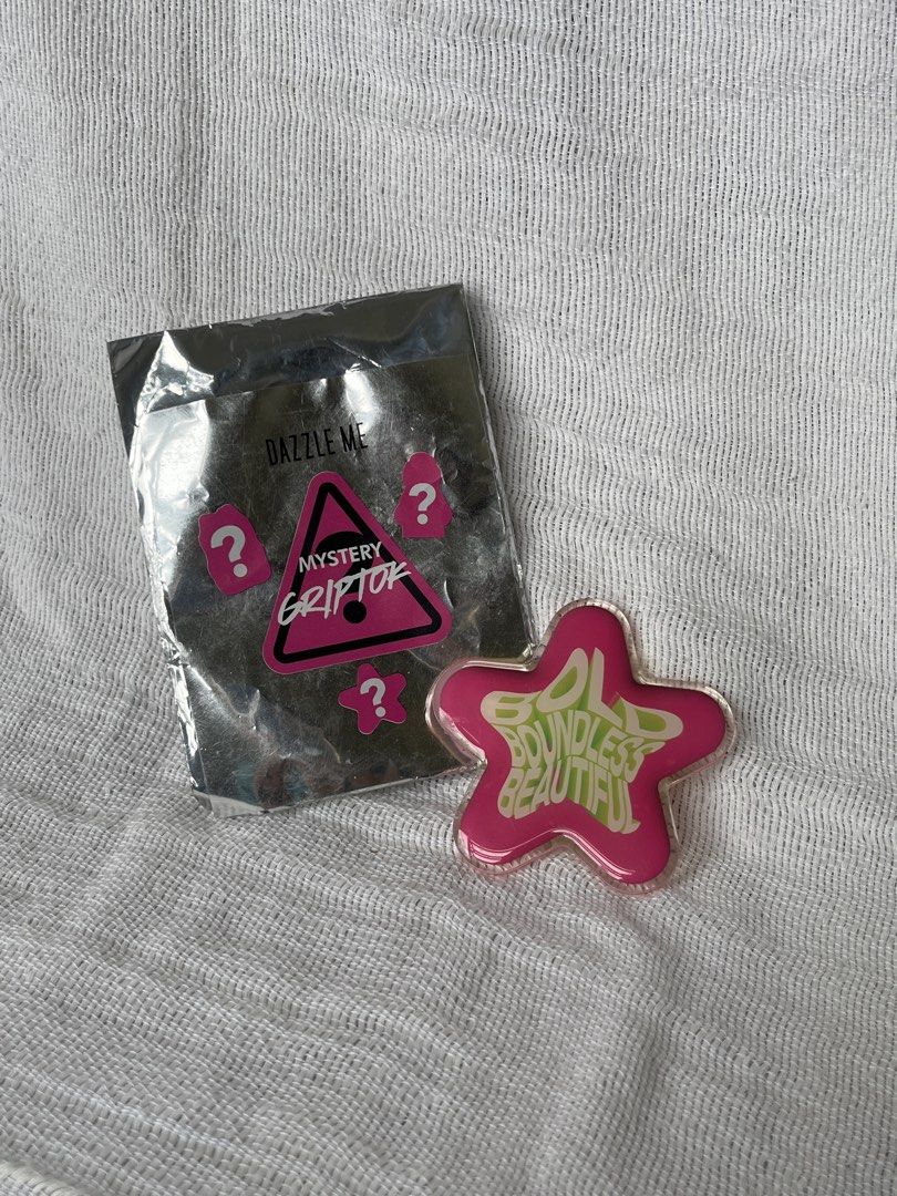 Dazzle Me Mystery Griptok Star Shaped Pink (Category: Other Mobile & Gadget Accessories) located in Manila. Submitted by prima_onda (Listing ID 1453662913, Image 2). Description: - Dazzle Me Mystery Griptok - Unique star shape - Pink design with 'Boundless Beautiful' text - Includes original mystery packaging - Ideal phone accessory - Unused.