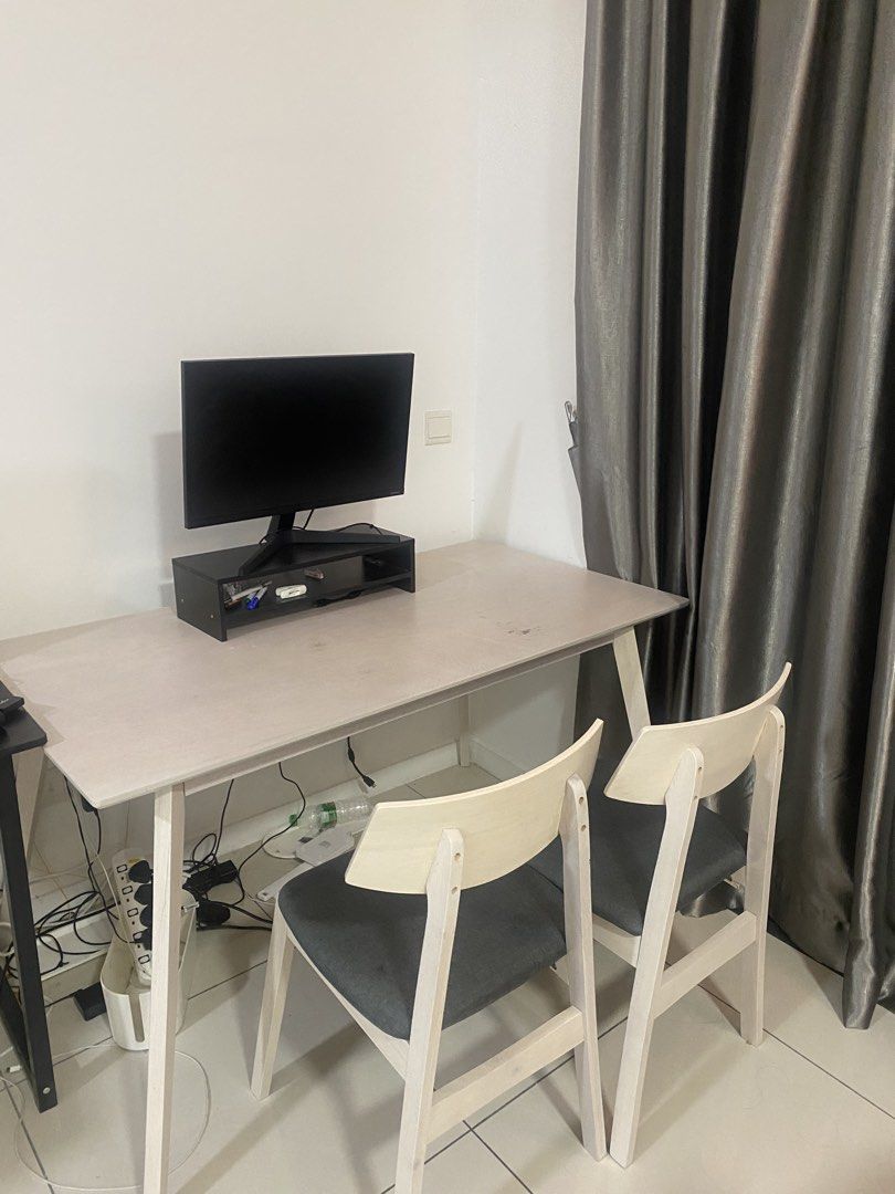 Dining table (Category: Tables & Sets) located in Kuala Lumpur. Submitted by hidayatika (Listing ID 1453777783, Image 1). Description: PICKUP ONLY IN WANGSA MAJU by tomorrow! Selling as me moving out.Selling a dining table and 6 seater. The desk has a light wood finish and is spacious enough for work or study. The chairs have wooden frames and dark grey cushioned seats. Great for a home office or study nook..