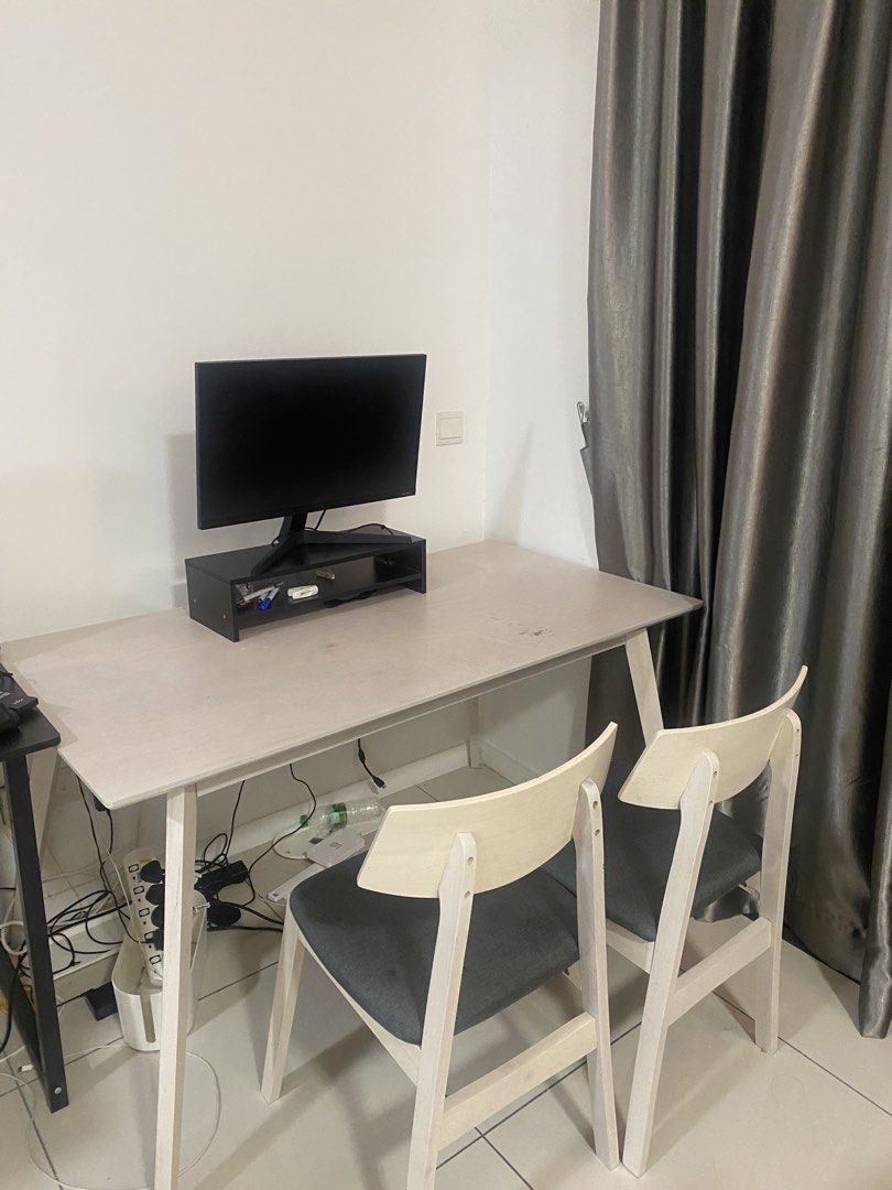 Dining table (Category: Tables & Sets) located in Kuala Lumpur. Submitted by hidayatika (Listing ID 1453777783, Image 2). Description: PICKUP ONLY IN WANGSA MAJU by tomorrow! Selling as me moving out.Selling a dining table and 6 seater. The desk has a light wood finish and is spacious enough for work or study. The chairs have wooden frames and dark grey cushioned seats. Great for a home office or study nook..