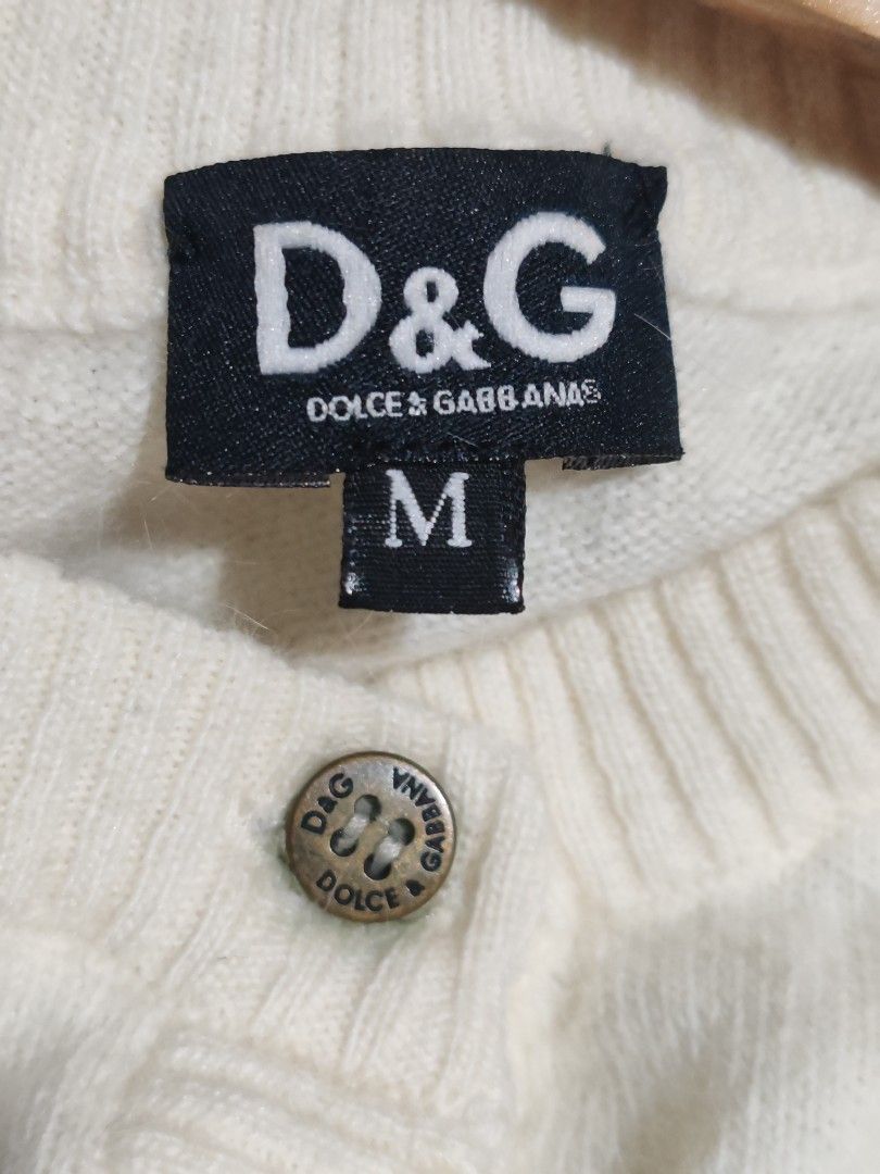 Dolce & gabbana (Category: Luxury Apparel) located in Manila. Submitted by ritzselect26 (Listing ID 1453683777, Image 3). Description: D & G knitted cream cropped cardigan Button down Metal chest logo Size medium on tag Width-19" Lenght-18" Sleeve-23.5" Cut wash tag.