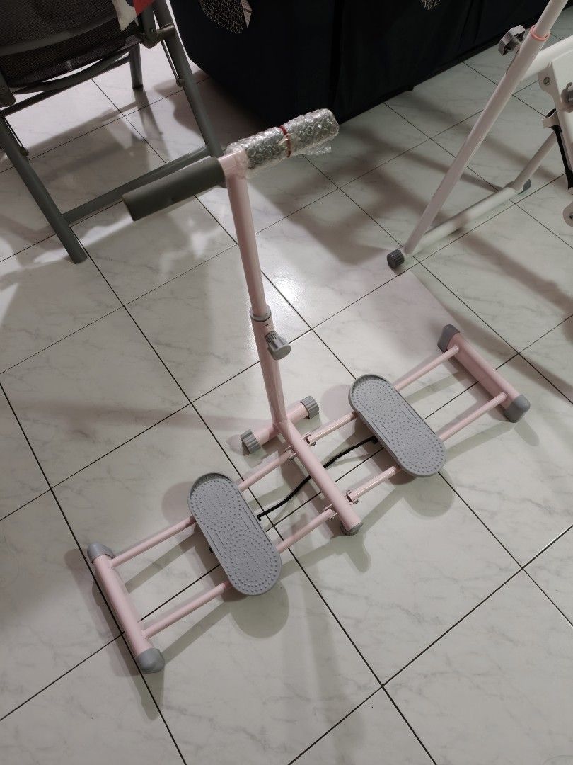 Exercise machine (Category: Cardio & Fitness Machines) located in Singapore. Submitted by simon.chai (Listing ID 1453755358, Image 1). Description: - Exercise machine designed for leg training. - Features a stylish pink frame. - Compact and suitable for home use. - Helps in toning and strengthening leg muscles..