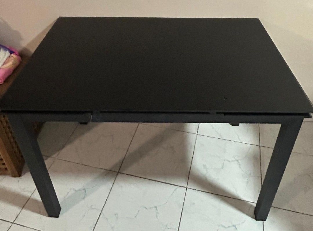 Extendable Dining Table (Category: Tables & Sets) located in Singapore. Submitted by Shikin (Listing ID 1453636050, Image 1). Description: - 110cm × 74 × 76.5cm - Extendable dining table - Sleek black glossy tabletop - Modern design - Easy to clean, tempered glass - with scratches, not for fussy buyer.
