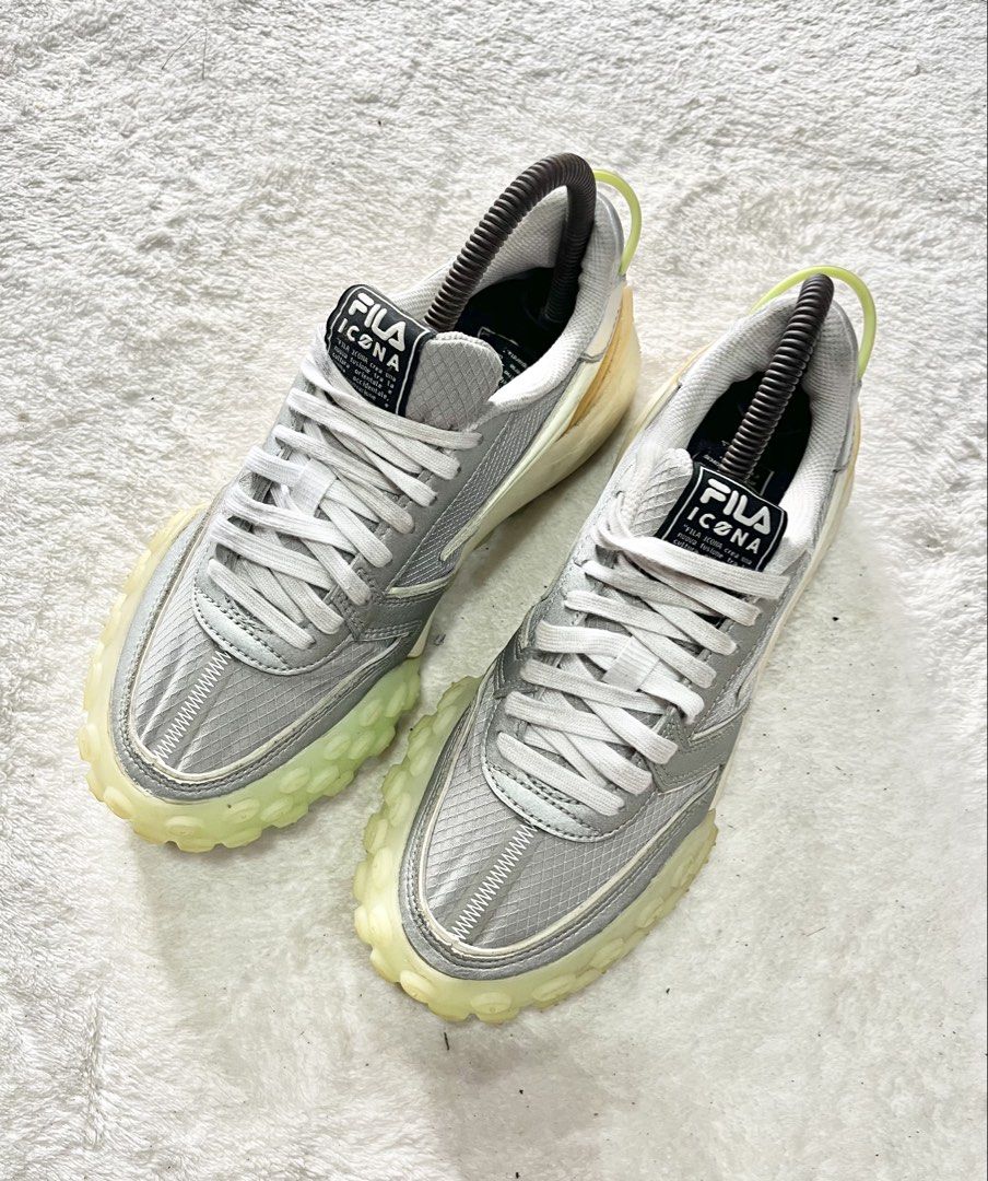 FILA Gara running shoes | Size 36 (Category: Sneakers) located in General Trias. Submitted by zrchustle.604 (Listing ID 1453701883, Image 2). Description: FILA Gara running shoes in a sleek silver-gray and white color palette. Key Design Elements Signature Sole: It features a chunky, semi-translucent gum outsole with prominent nodular treads wrapping up the toe bumper and heel. Upper Material: Crafted with a lightweight mesh grid panel overlaid w