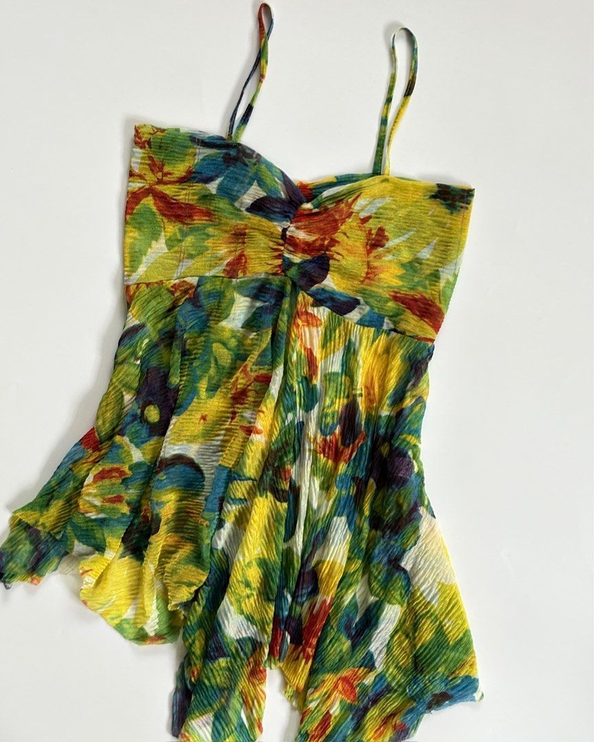 Floral Print Ruched Camisole Top (Category: Sleeveless) located in Tarlac. Submitted by kr_closet (Listing ID 1453791912, Image 2). Description: - Vibrant floral print camisole top - Ruched detail at the bust - Flowy handkerchief hem - Adjustable spaghetti straps - Lightweight and airy fabric - Perfect for casual wear or beach cover-up.