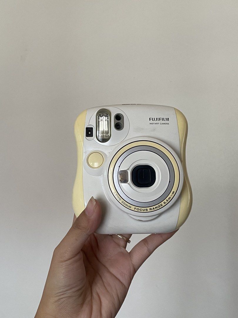 Fujifilm Instax Mini 25 (Category: Cameras) located in Manila. Submitted by declutteredbyalex (Listing ID 1453667084, Image 2). Description: - In very good condition. Very clean with no scratches. - All latches are intact and not broken. - It currently has 1 battery inside (missing 1 to complete the set). Please note this uses CR2 lithium batteries, not standard AAs. - UNTESTED. I found this in storage and haven’t had the time to test it with a f