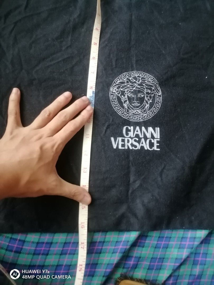 Gianni Versace Dust Bag Medusa Head (Category: Luxury Bags & Wallets) located in Naga. Submitted by mrwisethrifter (Listing ID 1453639300, Image 2). Description: - Authentic Gianni Versace dust bag - Black fabric with iconic white Medusa head logo and brand name - Secure drawstring closure - Ideal for storing shoes, bags, or accessories - Approximate dimensions: 19 inches (length) x 15 inches (width).
