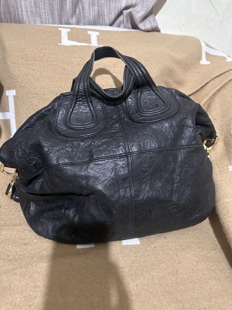 Givenchy Black Leather Nightingale Handbag (Category: Luxury Bags & Wallets) located in Tarlac. Submitted by kishya2024 (Listing ID 1453627962, Image 1). Description: - Genuine black leather Givenchy Nightingale bag - Zipper closure for security - Elegant gold hardware details - Spacious interior, ideal for daily essentials - A timeless and classic piece for any wardrobe -No code -nice in actual.