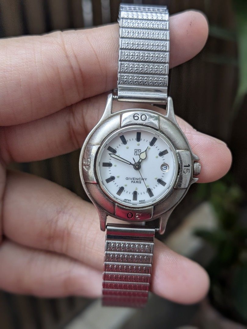 Givenchy Life Royal Sport Timepiece Watch (Category: Luxury Watches) located in Quezon City. Submitted by nnncorner (Listing ID 1453664012, Image 3). Description: Original Givenchy Life Royal Sport Vintage Timepiece Watch PLEASE MAKE READING A HABIT 100% original Stretchable Band Strap 5 peso coin size dial Fits wrist 17-22cm 8.9/10 condition Has date window No scratches or hairlines on glass face All parts are original Water Resistant Japan Move