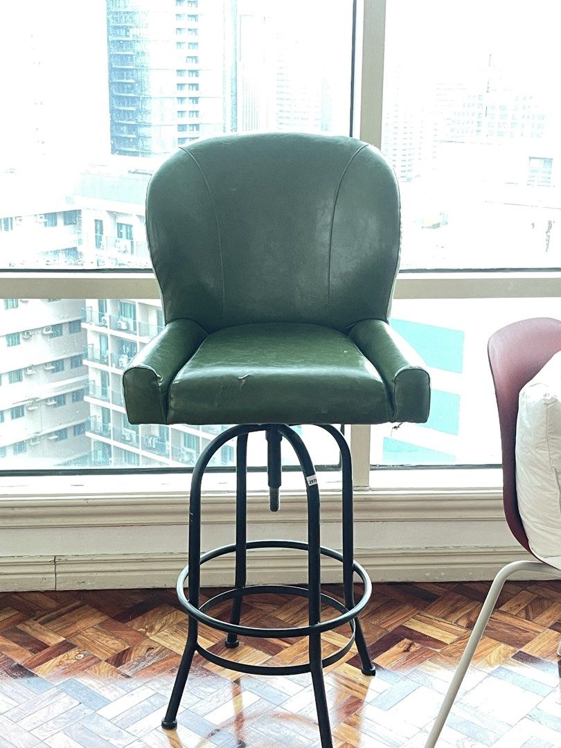 Green Leather Swivel Bar Chair (Category: Chairs) located in Tanza. Submitted by johnmartyntambis (Listing ID 1453629914, Image 1). Description: Green Leather Swivel Bar Chair Slight tear 30” seat height 45” total height Good for vintage/mid century home Pickup location: Meralco Ave., Pasig City.