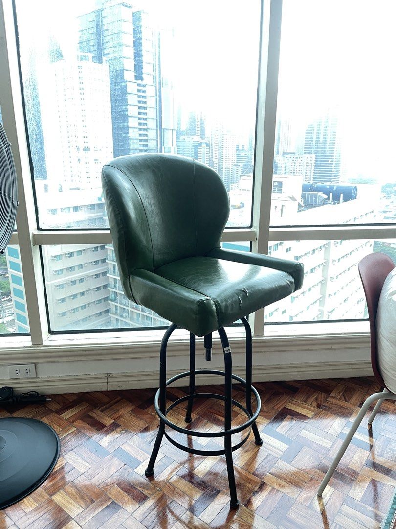 Green Leather Swivel Bar Chair (Category: Chairs) located in Tanza. Submitted by johnmartyntambis (Listing ID 1453629914, Image 3). Description: Green Leather Swivel Bar Chair Slight tear 30” seat height 45” total height Good for vintage/mid century home Pickup location: Meralco Ave., Pasig City.