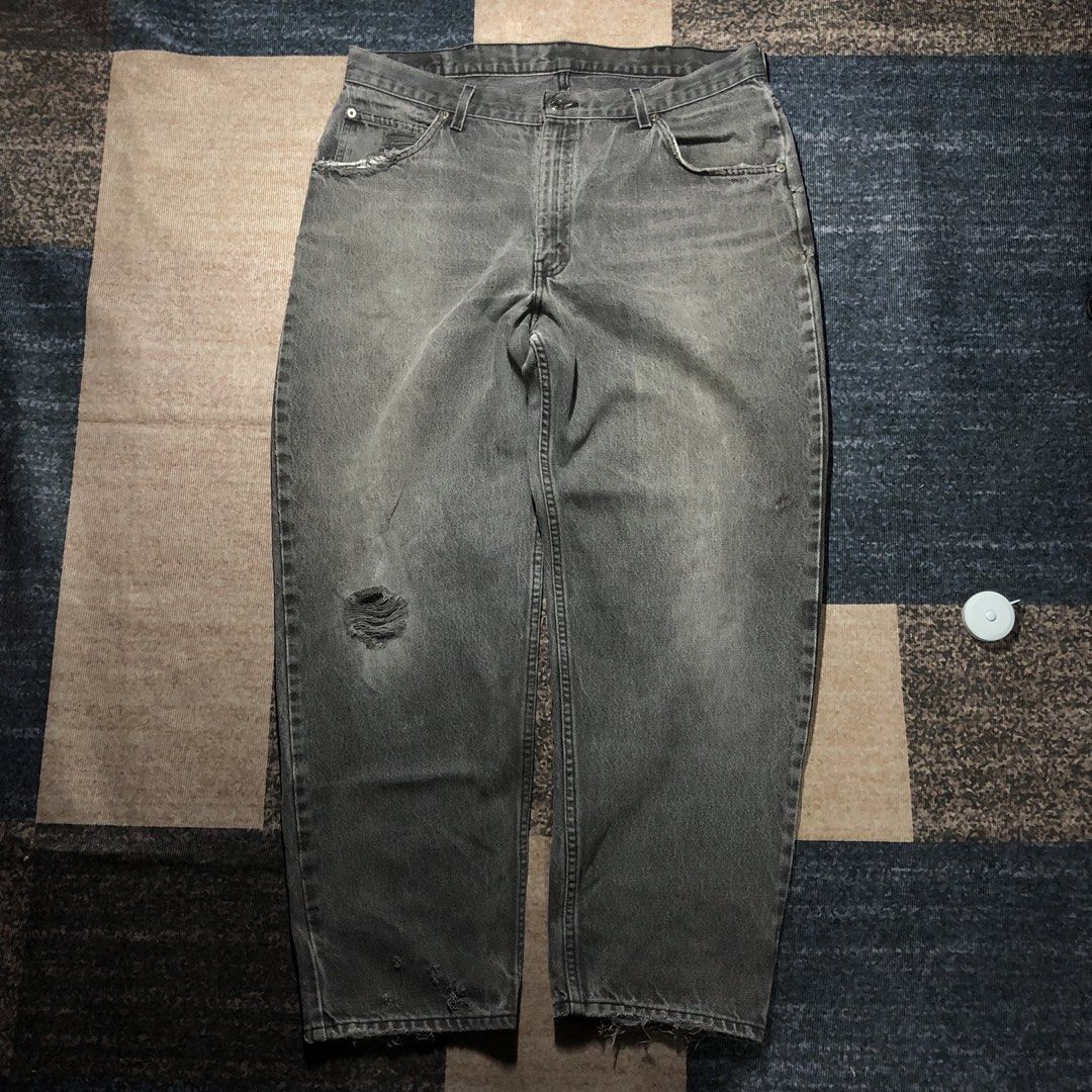 Grey Wash Distressed Denim Jeans (Category: Jeans) located in Dasmarinas. Submitted by johnlloydm99208 (Listing ID 1453732518, Image 1). Description: - Grey wash - Distressed with rips on front and hem - Button fly closure - Staple wardrobe item - Perfect for casual wear.