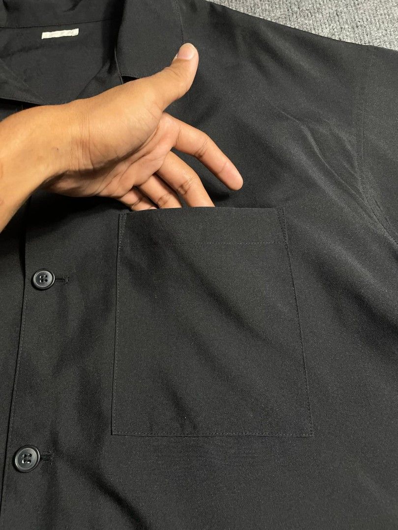 GU Black Short Sleeve Button Up Shirt (Category: Activewear) located in Ligao. Submitted by merjudioma64633 (Listing ID 1453738534, Image 3). Description: - Classic black short sleeve shirt - Single chest pocket - Button-up front - Relaxed fit for comfortable casual wear - Versatile and easy to style for everyday outfits.