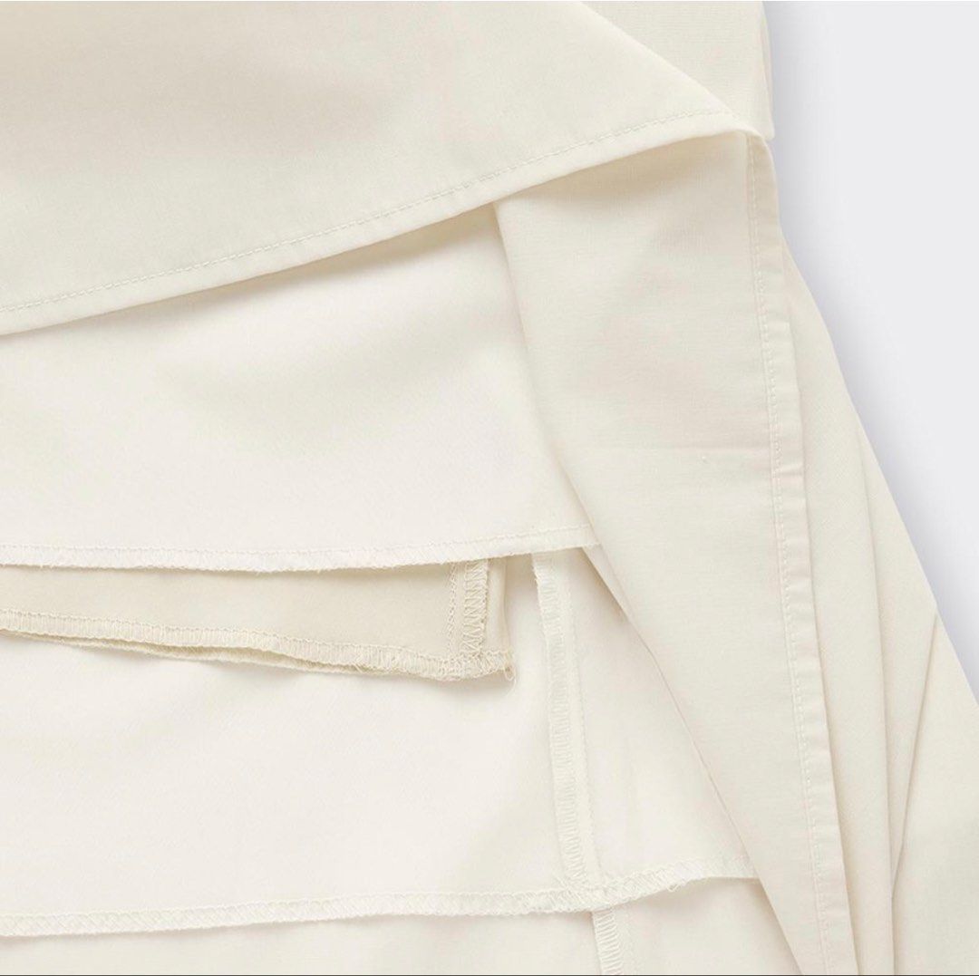 GU Tuck Flared Midi Skirt Size S (Category: Skirts) located in Manila. Submitted by _closetcleanup (Listing ID 1453708566, Image 2). Description: - Cream colored midi skirt from GU - Comfortable elastic waistband - Stylish pleated design - Versatile for casual or dressy occasions - Easy to style.
