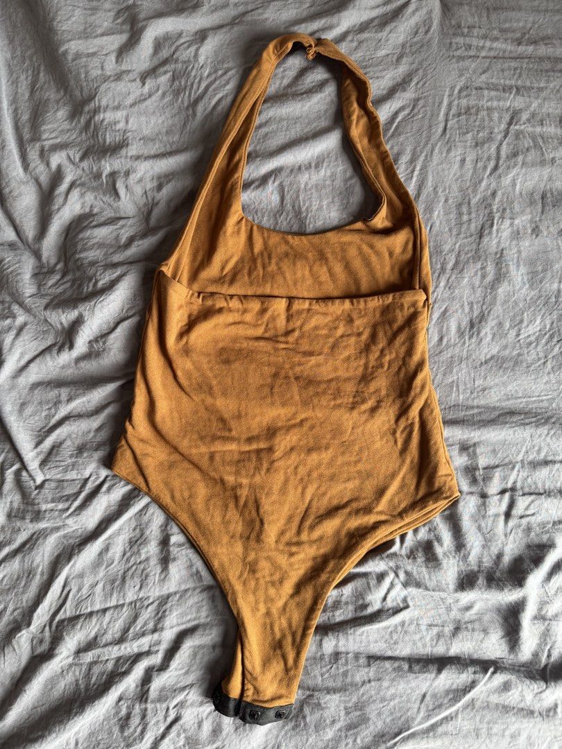 Halter body suit (Category: Sleeveless) located in Manila. Submitted by ls.closet (Listing ID 1453655100, Image 3). Description: - Mustard yellow / brown-ish halter top - Halter body suit - Semi-backless - Perfect for casual wear.