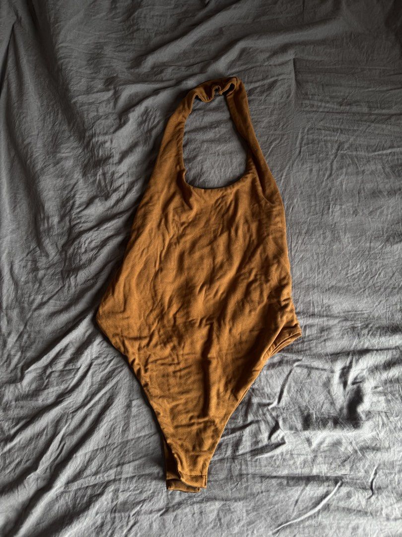 Halter body suit (Category: Sleeveless) located in Manila. Submitted by ls.closet (Listing ID 1453655100, Image 2). Description: - Mustard yellow / brown-ish halter top - Halter body suit - Semi-backless - Perfect for casual wear.