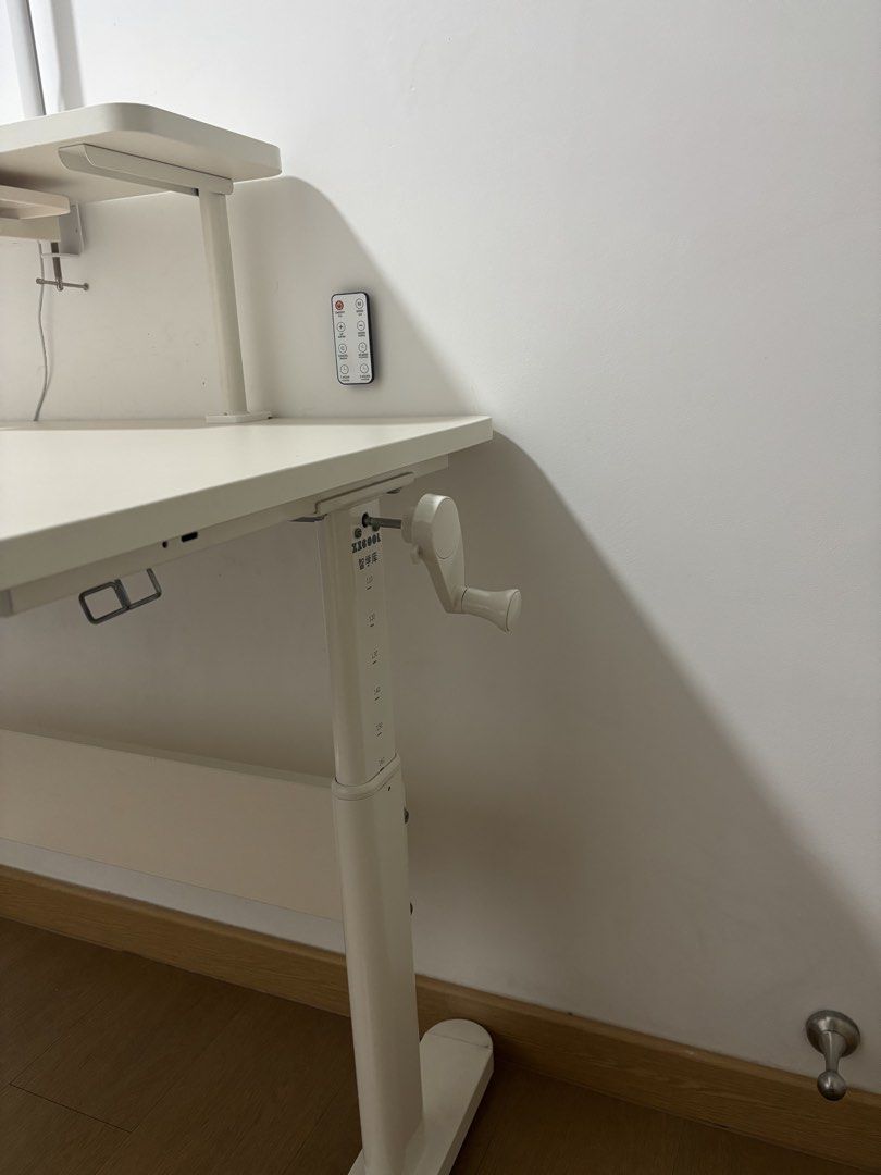 Height Adjustable Study / Computer Desk (Category: Tables & Sets) located in Singapore. Submitted by shonvic (Listing ID 1453629299, Image 3). Description: Selling a height-adjustable study/computer desk in excellent condition. Clean, sturdy, and fully functional. Features: * Manual crank height adjustment (smooth and easy to use) * Spacious white desktop * Removable upper shelf – use it with or without the shelf * Adjustable book/tablet holder *