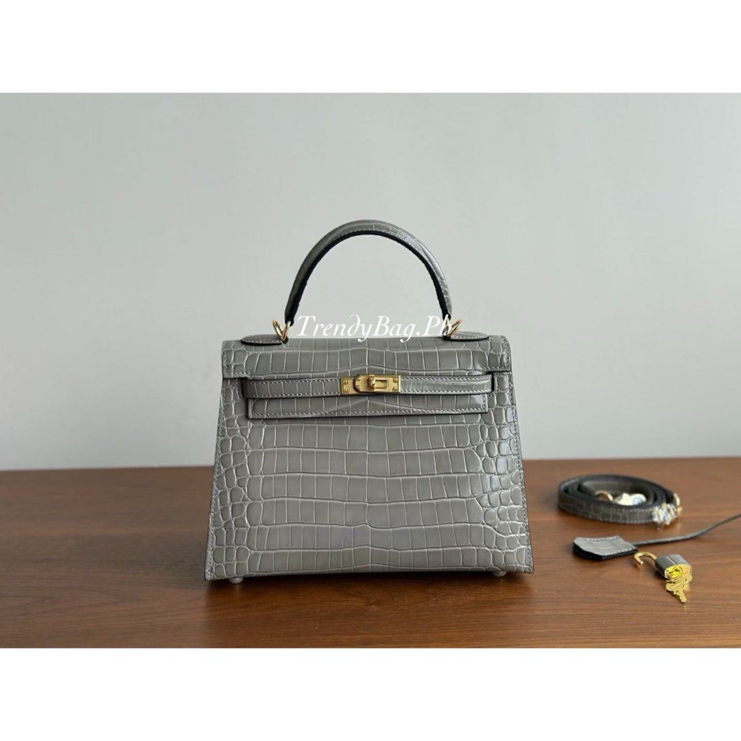 Hermes Kelly 25cm Crocodile Leather Grey (Category: Luxury Bags & Wallets) located in Pasig City. Submitted by trendybag.ph (Listing ID 1453805812, Image 1). Description: Looking for a classy and durable bag? 👜 Our Hand-Stitched Leather Bags feature: ✨ Fine stamp details ✨ Code stamp ✨ Premium quality leather ✨ Stylish and durable Perfect for everyday use or gifting ✨ 🚚 Shipping / Delivery Available 📍 Pick-up Available PM for orders & inquirie