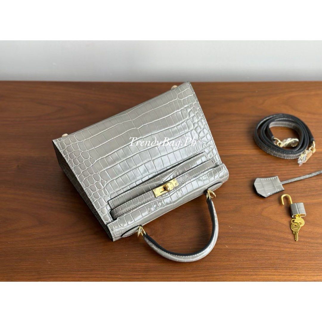 Hermes Kelly 25cm Crocodile Leather Grey (Category: Luxury Bags & Wallets) located in Pasig City. Submitted by trendybag.ph (Listing ID 1453805812, Image 3). Description: Looking for a classy and durable bag? 👜 Our Hand-Stitched Leather Bags feature: ✨ Fine stamp details ✨ Code stamp ✨ Premium quality leather ✨ Stylish and durable Perfect for everyday use or gifting ✨ 🚚 Shipping / Delivery Available 📍 Pick-up Available PM for orders & inquirie
