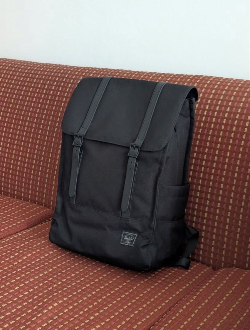 Herschel Tonal Black Survey Backpack 20L (Category: Backpacks) located in Caloocan City. Submitted by dawncollectiv (Listing ID 1453796763, Image 2). Description: - Classic black Herschel backpack - Spacious main compartment with laptop sleeve - Front pocket with zip closure - Side water bottle pockets - Padded shoulder straps for comfort - Durable construction - Ideal for school or everyday use - Easily fits 13-15” laptop.