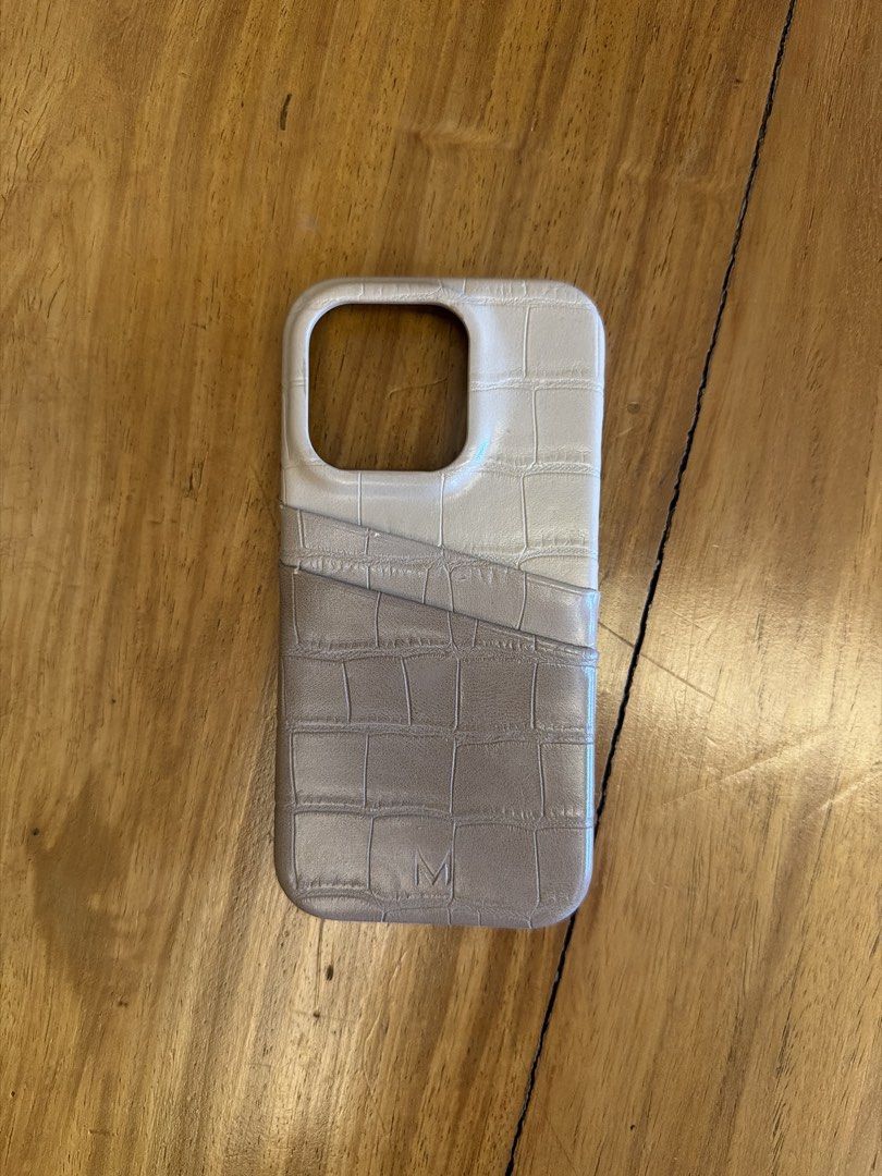 iPhone 15 pro card holder phone case (Category: Cases & Sleeves) located in Quezon City. Submitted by ksotto (Listing ID 1453676473, Image 1). Description: - Brand: Muse on the Move (fr Bangkok) - built in cardholder case - Vegan Leather - used twice only - original price: PHP 2,400.