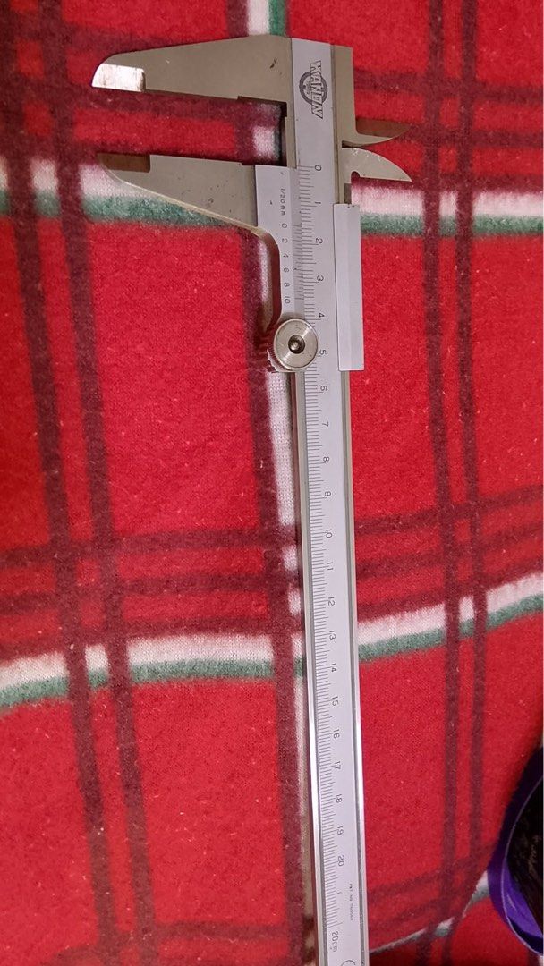 KANON 20cm Vernier Caliper (Category: Construction Tools & Equipment) located in Mandaluyong City. Submitted by fashionski_shoppers (Listing ID 1453659787, Image 1). Description: - KANON Vernier Caliper - Measures up to 20cm - Ensures precise measurements - Shows some signs of use, but fully functional - Perfect for DIY projects or professional applications.