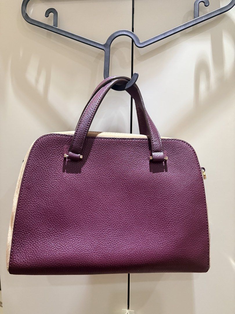 Kate Spade Pebbled Leather Satchel Handbag (Category: Luxury Bags & Wallets) located in Mandaluyong City. Submitted by mariegeronimo (Listing ID 1453681161, Image 2). Description: Kate Spade Kay Street Small Felix Satchel - Classic Kate Spade satchel - Deep plum pebbled leather with cream accents - Gold hardware details - Top handles for carrying - Spacious interior for essentials - Timeless and perfect for everyday use Length (Width): 11.0 inche