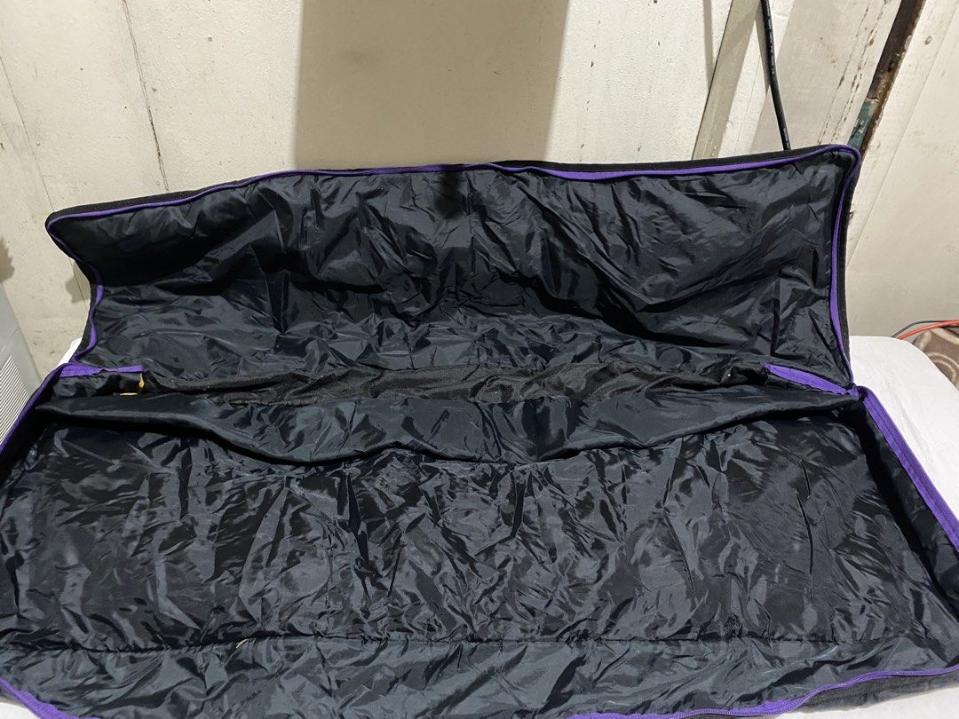 KBC Dynatone HS-000 Keyboard Gig Bag (Category: Musical Instruments) located in Manila. Submitted by resi.diaz (Listing ID 1453780287, Image 3). Description: - Approx: 103 x 35 x 11 cm - Black gig bag designed for keyboards. - Features stylish purple and green stripe accents on handles and trim. - Prominently displays the KBC Dynatone HS-000 logo on the front. - Offers ample interior space to comfortably fit your keyboard. - Secure zip closure en