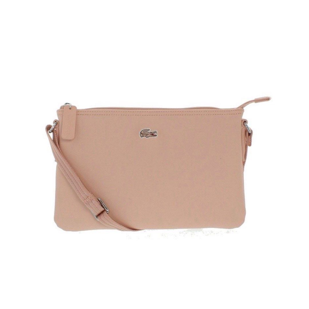 Lacoste Bag Flat Crossover in Cloud Pink (Category: Cross-body Bags) located in Manila. Submitted by neveroverdressed (Listing ID 1379961434, Image 1). Description: negotiable price! - fits a lot inside - used only once for a trip - dm for more pictures and dimensions of the bag (serious buyers only) rfs: no longer being used.