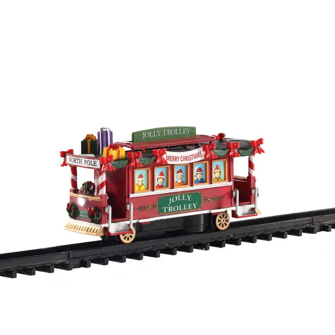 Lemax Jolly Trolley Christmas Village Train (Category: Vintage Collectibles) located in Santiago. Submitted by kitalpanga (Listing ID 1453738650, Image 2). Description: - Lemax Jolly Trolley for Christmas village setup. - Festive red trolley that runs on a track. - Features 'Merry Christmas' and 'North Pole' signs. - Decorated with presents and includes little figures inside. - Comes with a 131 cm (51") track. - An excellent addition to any holid