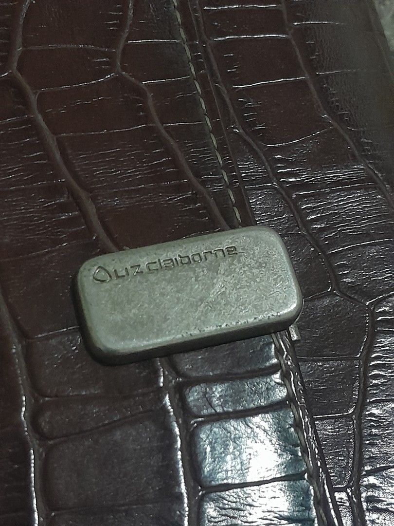 Liz Claiborne Brown Croc Trifold Wallet (Category: Wallets & Card holders) located in Pasig City. Submitted by miffych (Listing ID 1453735264, Image 2). Description: • can fit at least 14–16 cards • slightly nego for sure buyers only • can send more pics, js send a message • slight issue: needs cleaning and may scratches sa metallic logo clasp (see 2nd slide) • rfs: nakatambak lang.