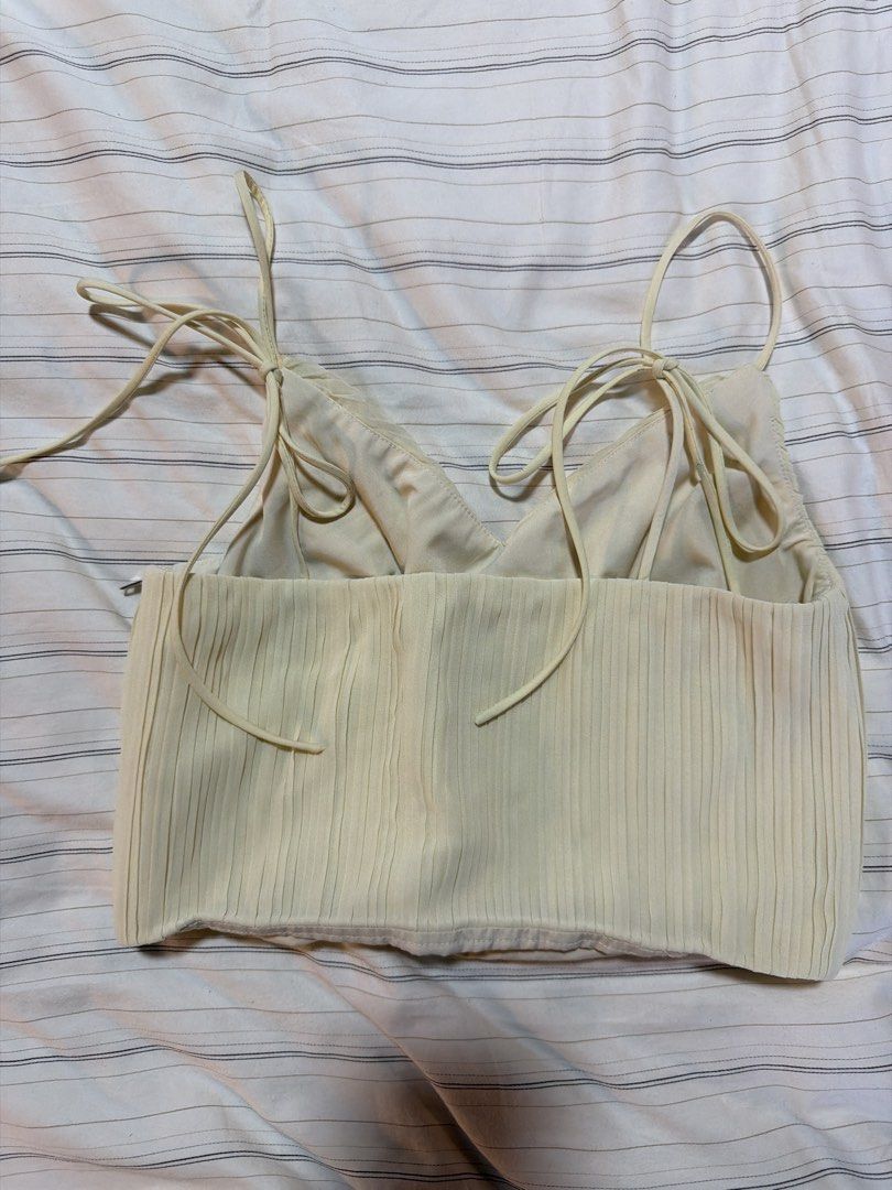 Love, Bonito Top (Category: Blouses) located in Taguig. Submitted by celinesells222 (Listing ID 1453715550, Image 2). Description: - Brand: Love, Bonito - Color: Butter Yellow - Size: S (UK 8, US 4) - Design: pleated crop top with ribbon ties on the straps -RFS: wrong size.