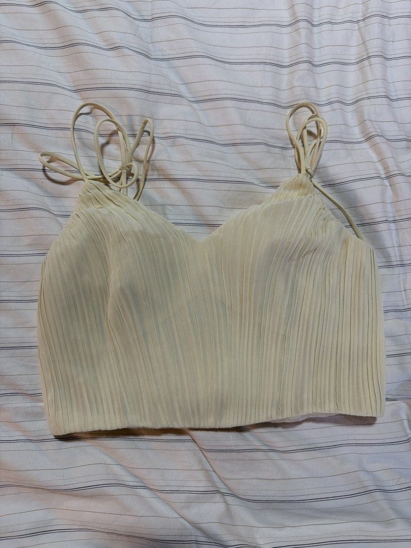 Love, Bonito Top (Category: Blouses) located in Taguig. Submitted by celinesells222 (Listing ID 1453715550, Image 1). Description: - Brand: Love, Bonito - Color: Butter Yellow - Size: S (UK 8, US 4) - Design: pleated crop top with ribbon ties on the straps -RFS: wrong size.