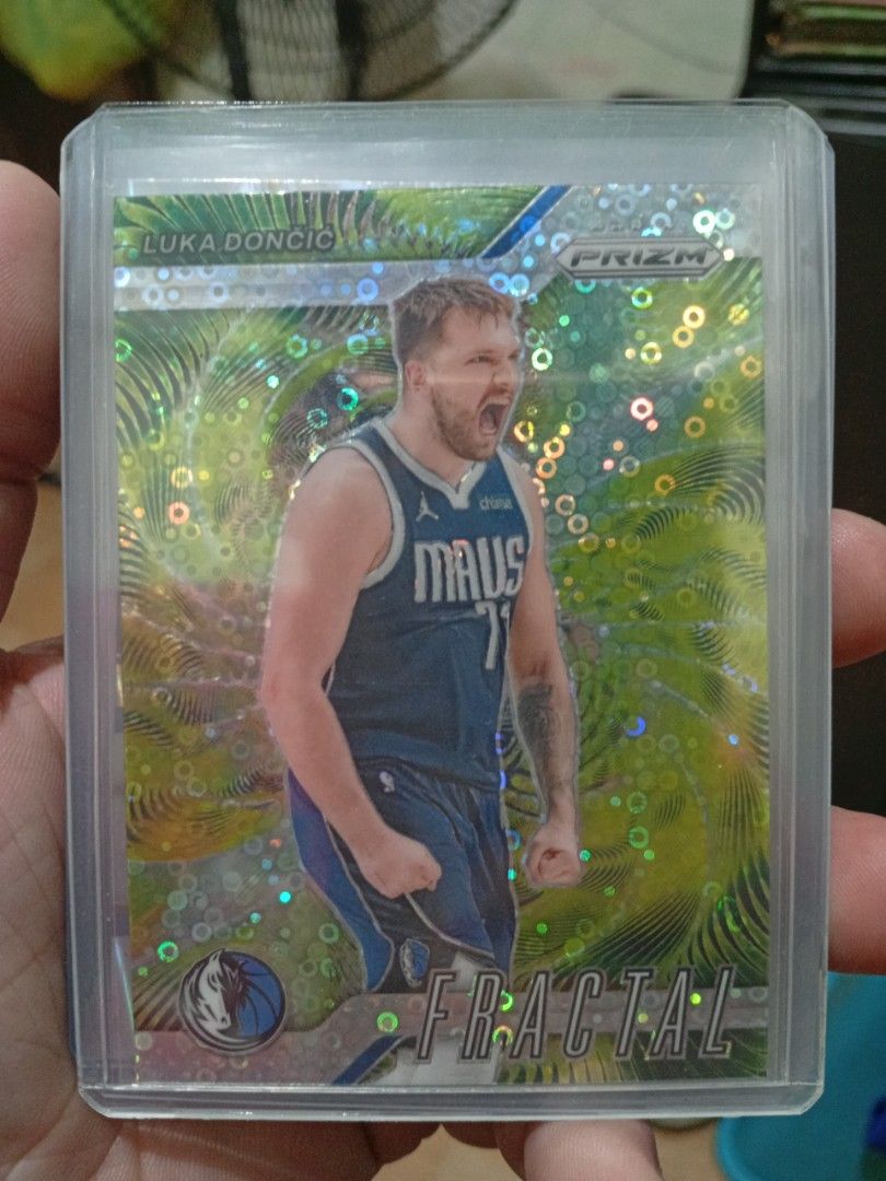 Luka Doncic Disco Fractal Card (Category: Raw Singles) located in Malabon City. Submitted by umamalousambaoa (Listing ID 1453761071, Image 1). Description: Selling as lot - 2024-25 Panini Prizm Luka Doncic Fractal Card Disco - Features Dallas Mavericks Star Luka Doncic - Excellent addition for any Luka or Mavericks collection - Card is in a protective sleeve - Don't miss out on this opportunity!.