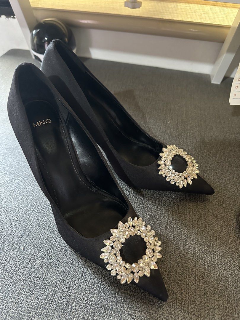 Mango Black Satin Heels with Crystal Embellishment (Category: Heels) located in Cainta. Submitted by erraticgal (Listing ID 1453490752, Image 1). Description: - Brand: Mango - Color: Black - Material: Satin - Style: Pointed-toe heels - Embellishment: Sparkly crystal on the front - Heel type: Classic stiletto - Occasion: Perfect for dressing up outfits, parties, or a night out. *USED ONLY ONCE (Graduation) Original price: 4,200 UK 6 .