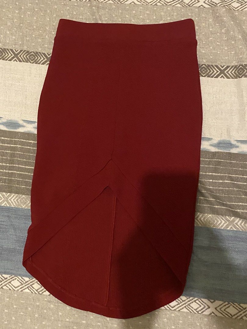 Maroon Asymmetrical Hem Midi Skirt (Category: Skirts) located in Tanauan. Submitted by rie098 (Listing ID 1453734165, Image 3). Description: - Deep maroon midi skirt - Unique asymmetrical hemline - Subtle fabric texture - Comfortable pull-on style with elastic waistband - Perfect for dressing up or down - Pairs well with heels or flats.