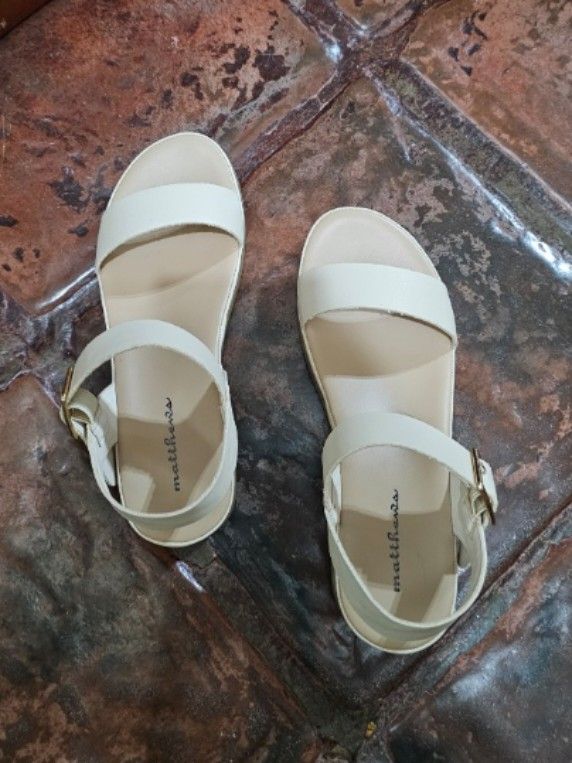 Matthews Nude Sandals with Ankle Straps (Category: Flats & Sandals) located in Makati City. Submitted by missdeclutterer (Listing ID 1453698502, Image 1). Description: Matthews strapped sandals in Nude with gold buckles ✨ ✔️ Brand New - New stock bought from SM Makati - Bought for Php 1699 - Never worn, completely forgot about it but well kept and properly stored - Size 7 - Great choice of sandals for casual and smart casual attire RFS: Declutter