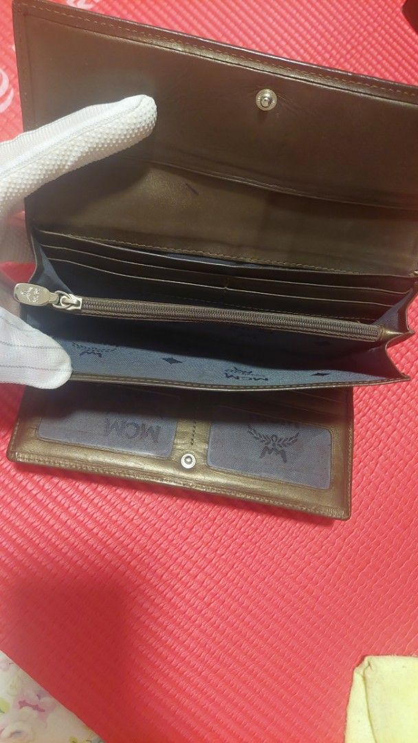 Limited Edition MCM Wallet & Bag Set (Category: Luxury Bags & Wallets) located in Paranaque City. Submitted by daddyu (Listing ID 1453690948, Image 3). Description: - Authentic MCM wallet & bag with signature monogram print. - Mix of textures and MCM logo emblem. - Ample card slots for organization. - Interior zippered compartment for secure storage. - Classic snap closure for easy access. - Perfect for everyday use. Wallet with Large Bag Set.