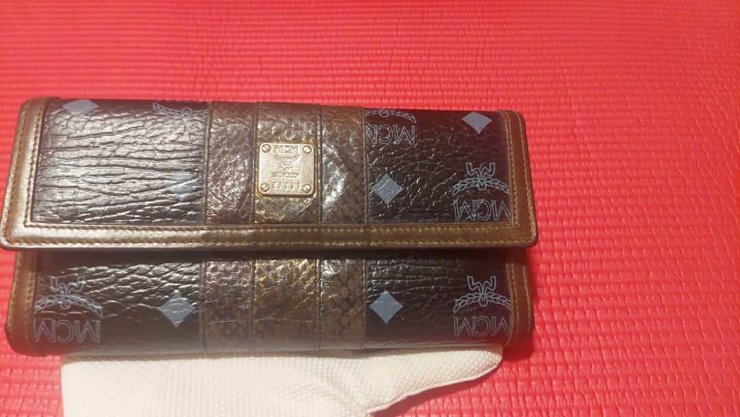 Limited Edition MCM Wallet & Bag Set (Category: Luxury Bags & Wallets) located in Paranaque City. Submitted by daddyu (Listing ID 1453690948, Image 2). Description: - Authentic MCM wallet & bag with signature monogram print. - Mix of textures and MCM logo emblem. - Ample card slots for organization. - Interior zippered compartment for secure storage. - Classic snap closure for easy access. - Perfect for everyday use. Wallet with Large Bag Set.