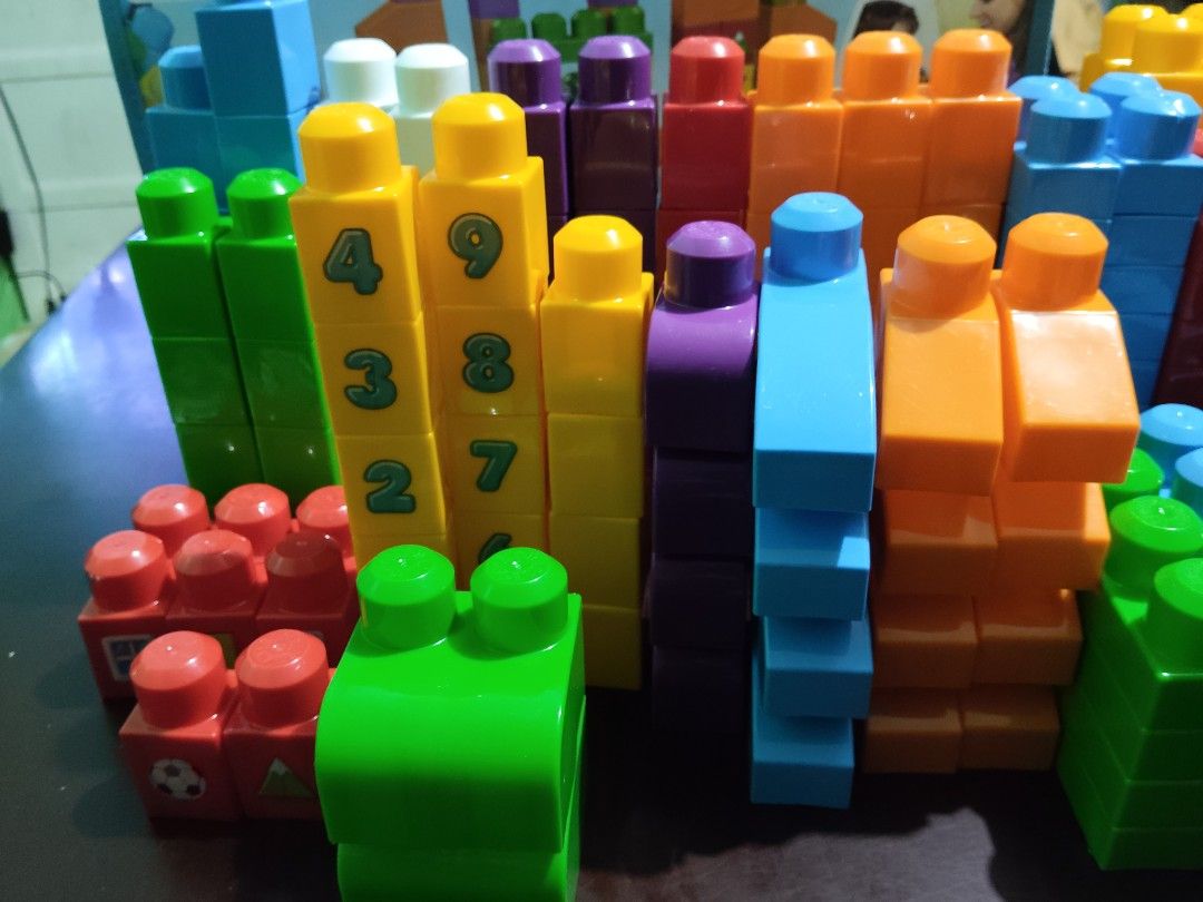 Mega Bloks 150 Pieces Building Blocks Set (Category: Lego & Building Sets) located in Paranaque City. Submitted by ca.firstonlinebiz (Listing ID 1453642623, Image 2). Description: - Mega Bloks building blocks set - 150 pieces included - Assorted vibrant colors: blue, green, yellow, orange, purple, red - Some blocks feature number prints - Encourages creative play and building skills - Convenient storage bag included - Hours of fun for children.