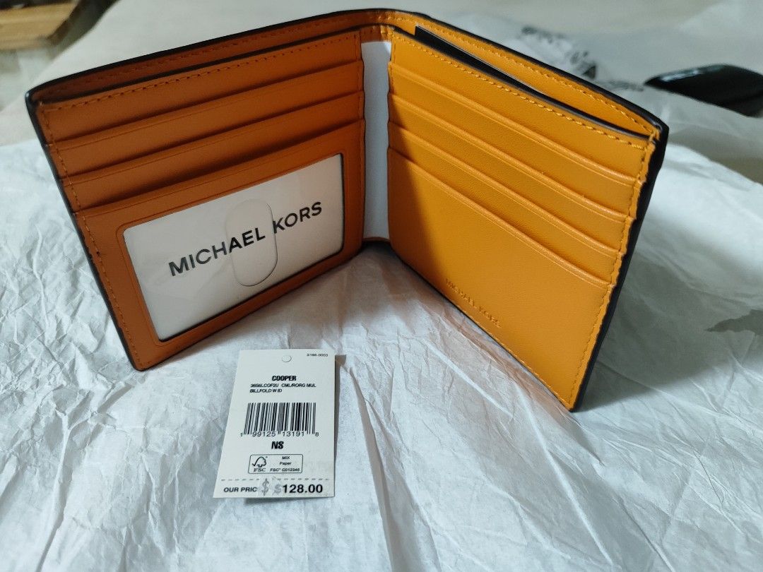 Michael kors cooper billfold camel/ burnt orange multi colorway (Category: Wallets & Card Holders) located in Quezon City. Submitted by edgara26 (Listing ID 1453780422, Image 2). Description: authentic/original/ bought from US 128usd wallet only no box brandnew qc area slight nego.