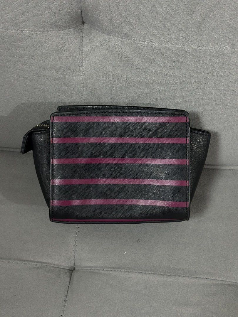 Michael Kors Striped Wallet Pouch (Category: Luxury Bags & Wallets) located in Tarlac. Submitted by via_banana (Listing ID 1453768876, Image 2). Description: - Authentic Michael Kors wallet pouch - Stylish black and maroon stripe design - Secure zippered compartment - Interior card slots for organization - Compact and perfect for essentials - Convenient D-ring attachment on the side - Interior is clean and well-maintained.